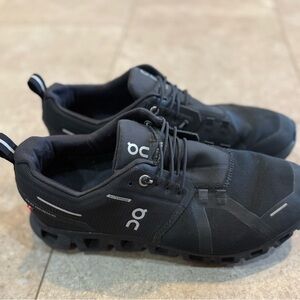 On Running Black Athletic Shoes with CloudTec Cushioning